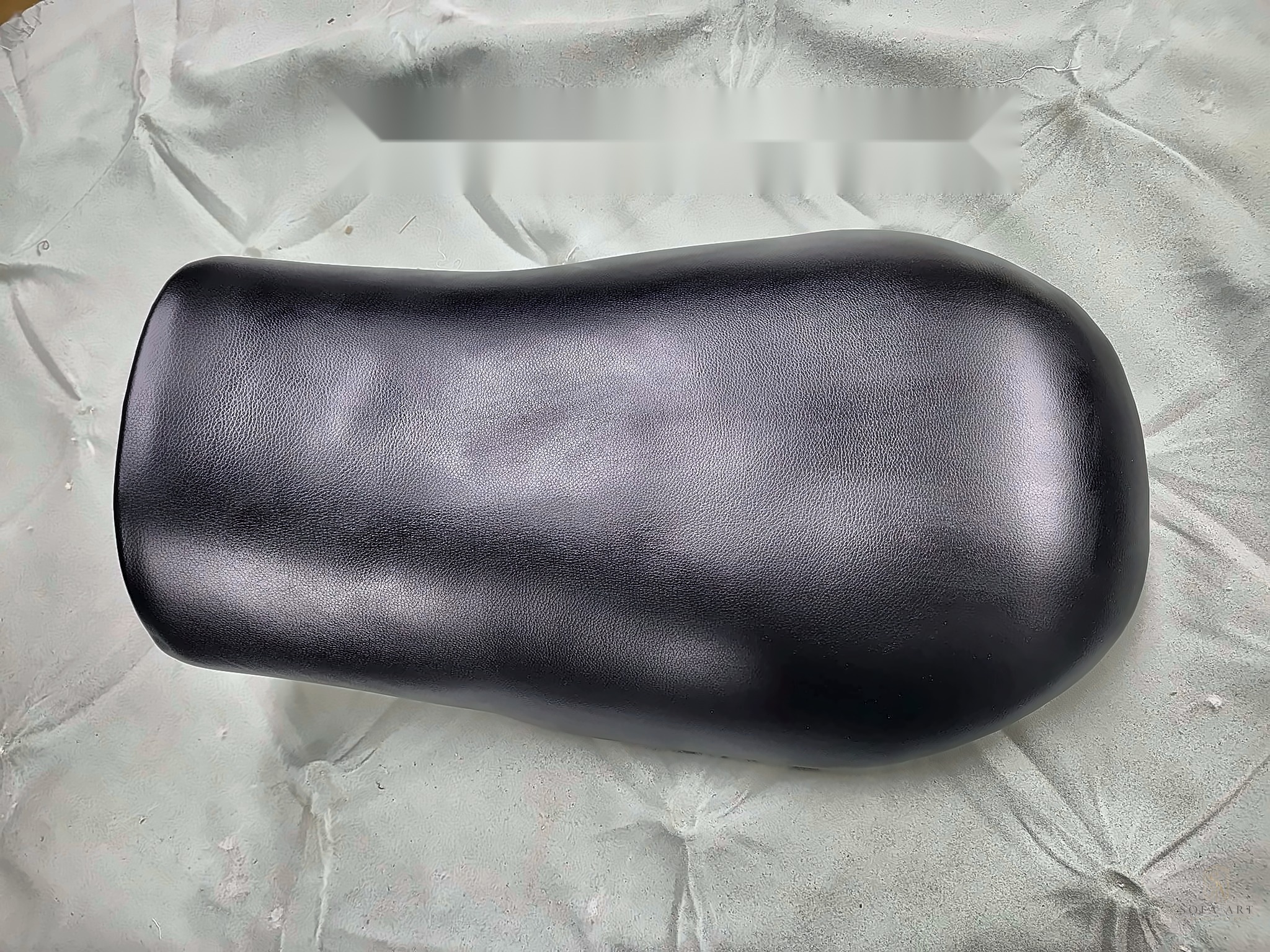 Motorcycle seat rebuilt in black leather