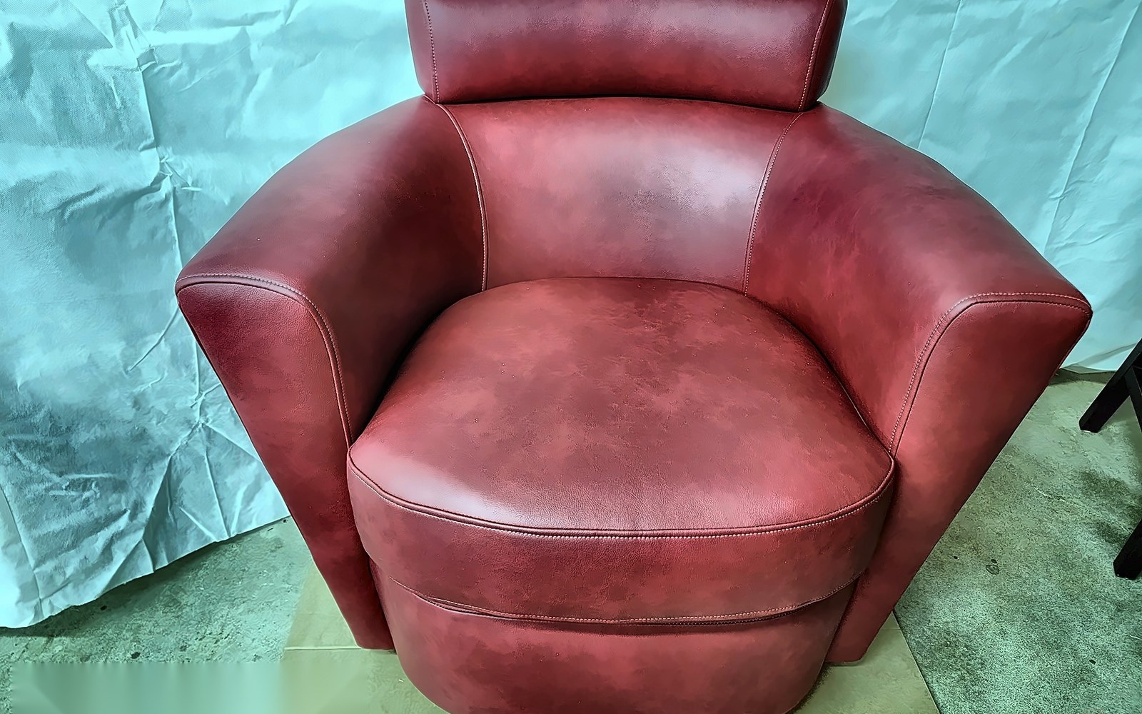 Red leather swivel chair after restoration — after